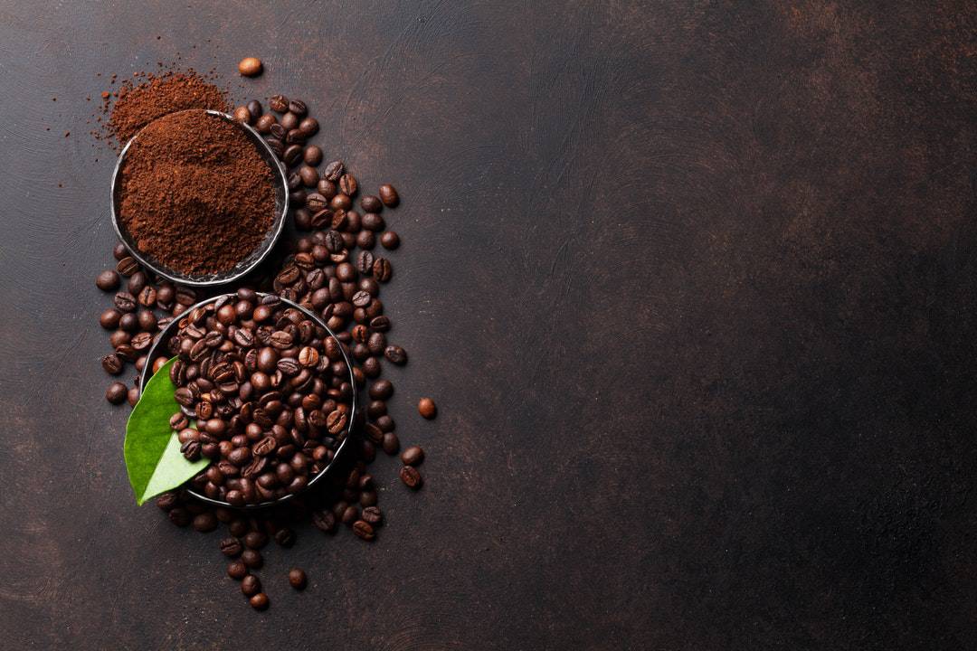 coffee beans ground in a cup