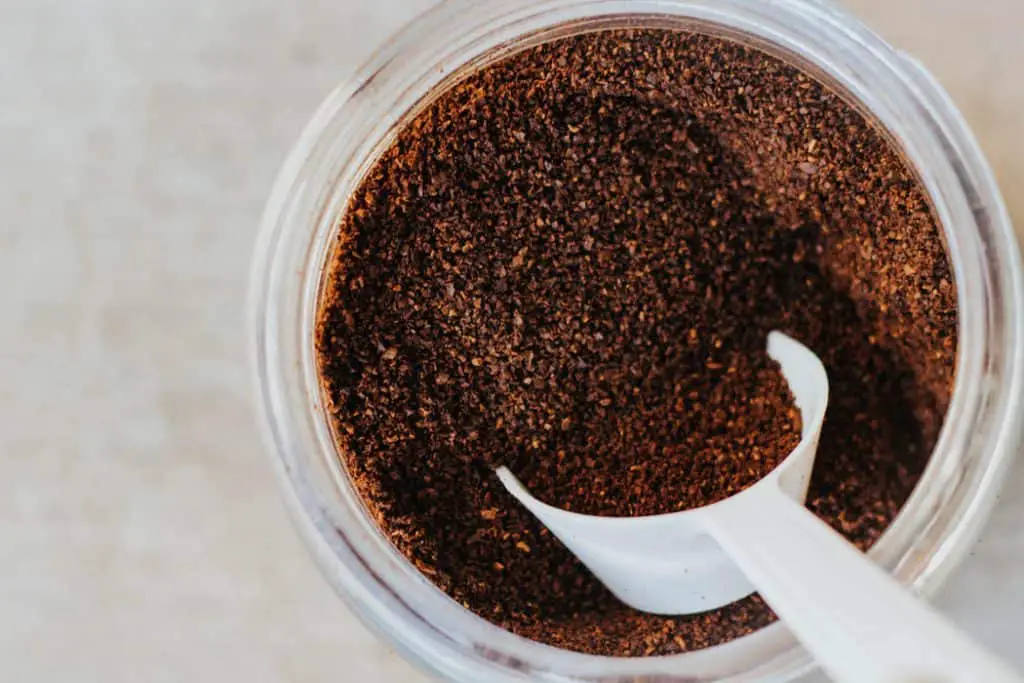 ground coffee in a plastic container