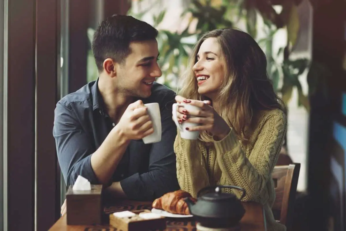 Couple Making and Drinking Coffee at Home.