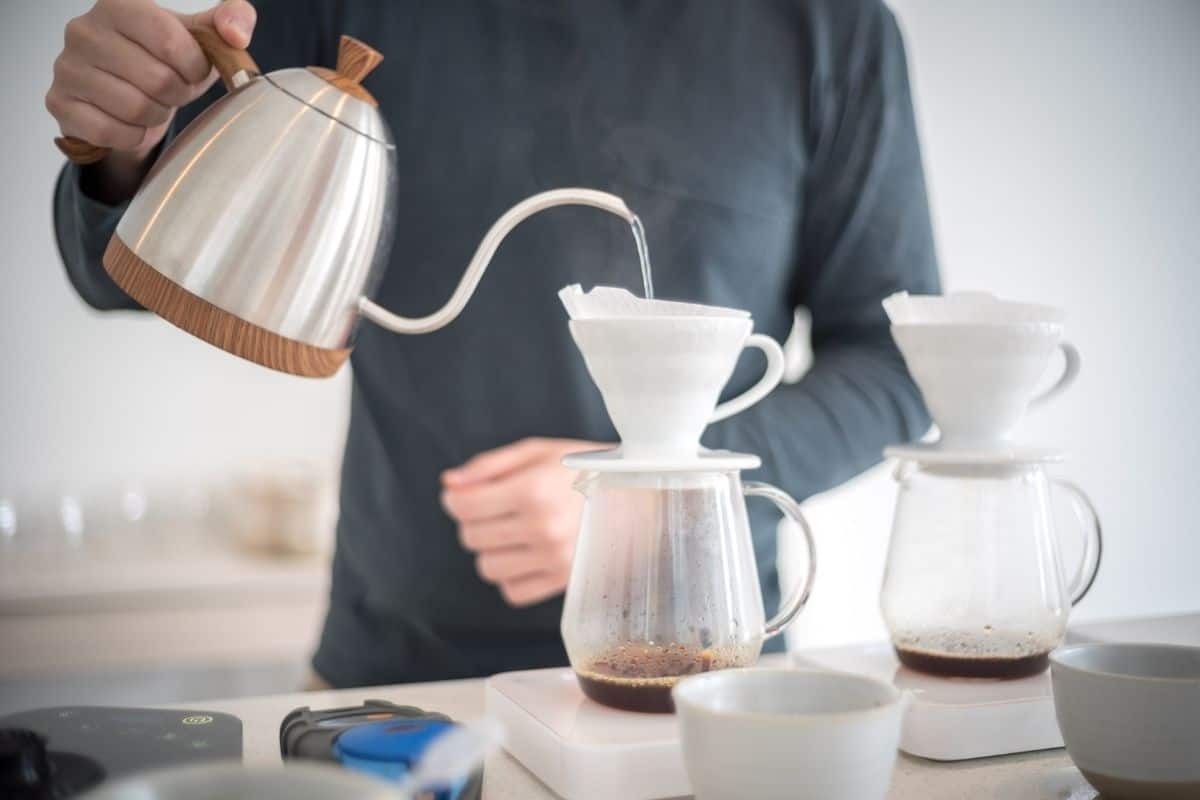 man brewing fresh coffee at home