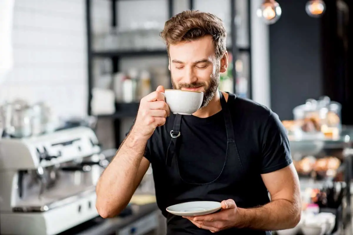 man enjoying a cup of strong black coffee.