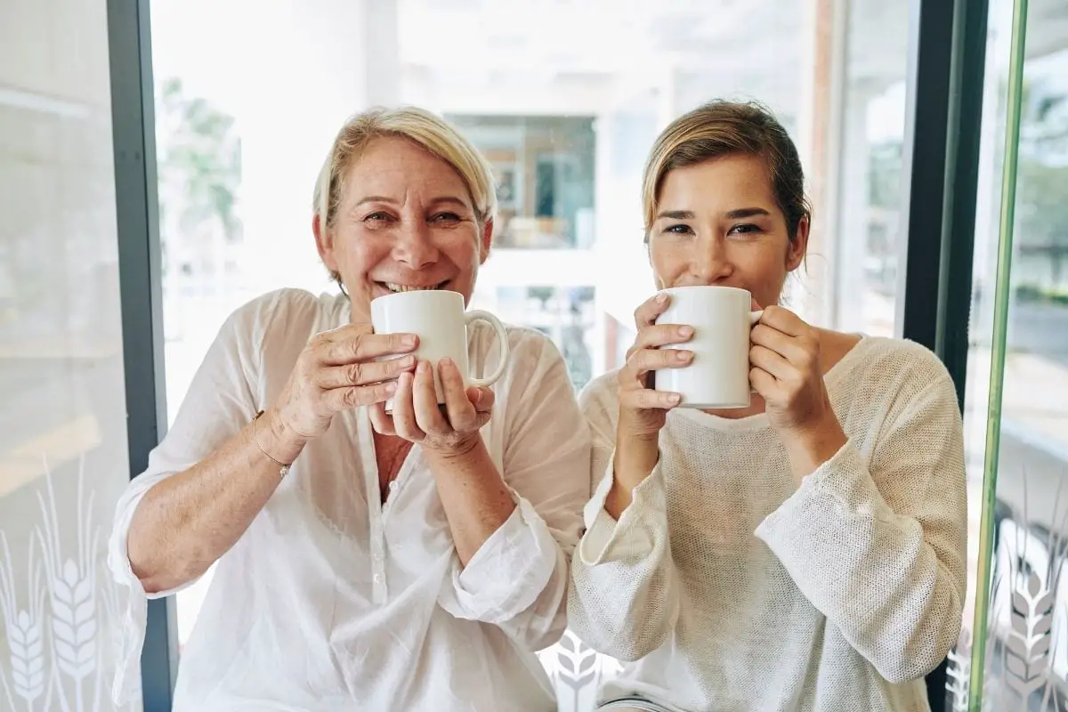 mother and daughter enjoying the benefits of drinking coffee