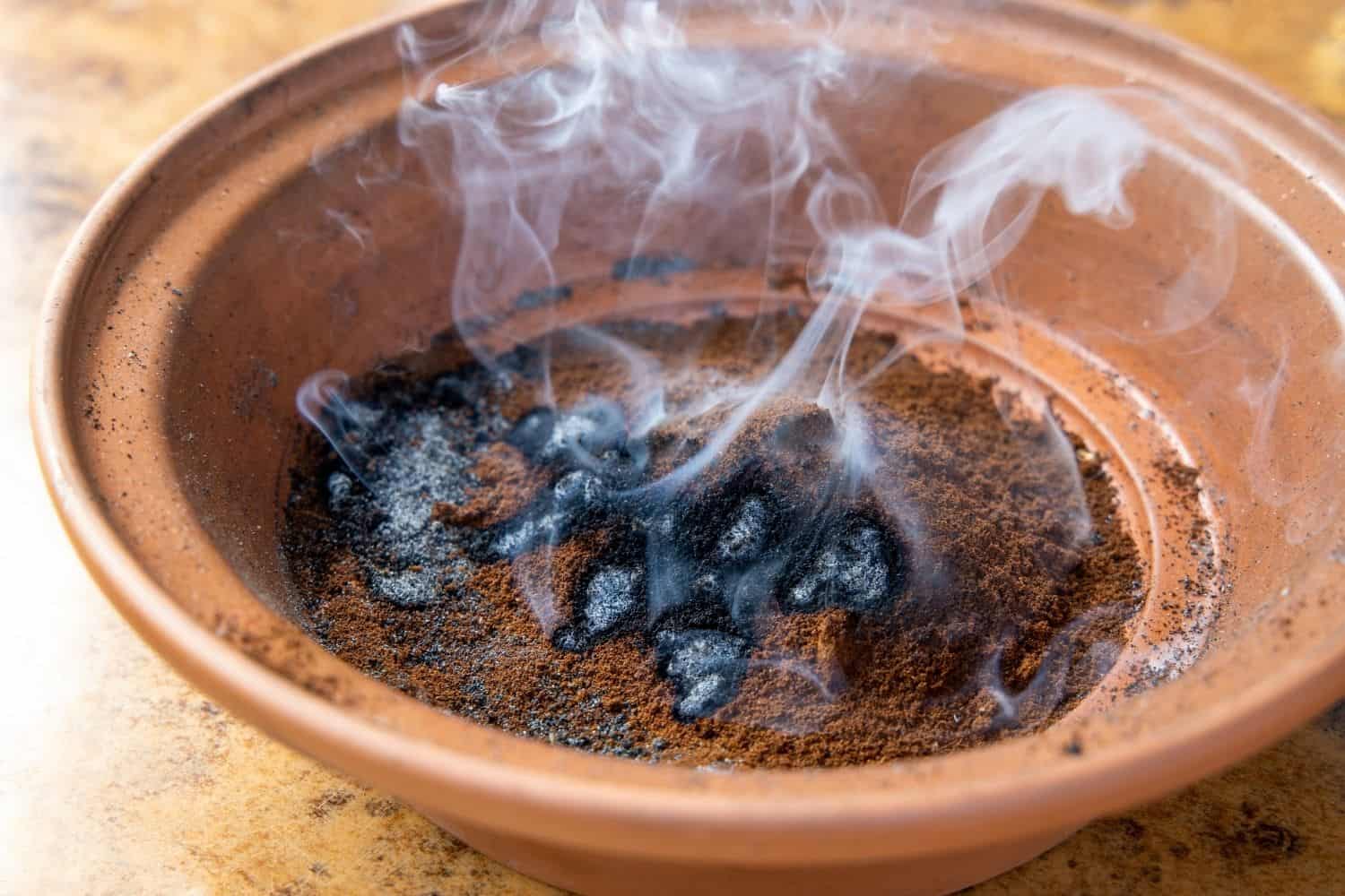 Burning coffee grounds.