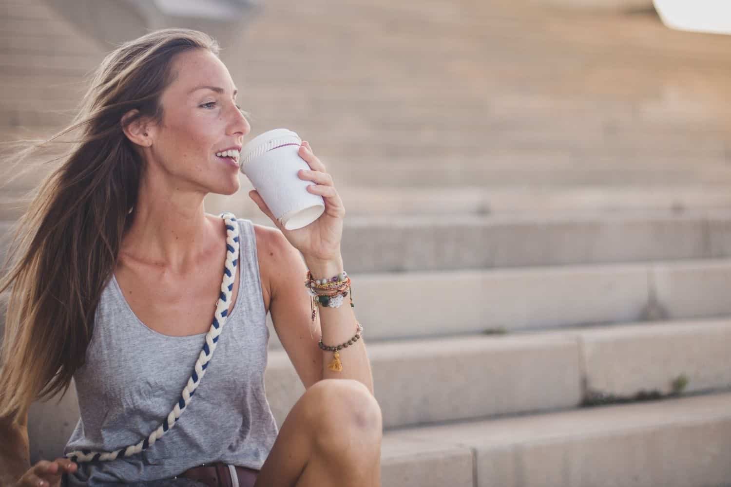 woman drinking hot coffee.