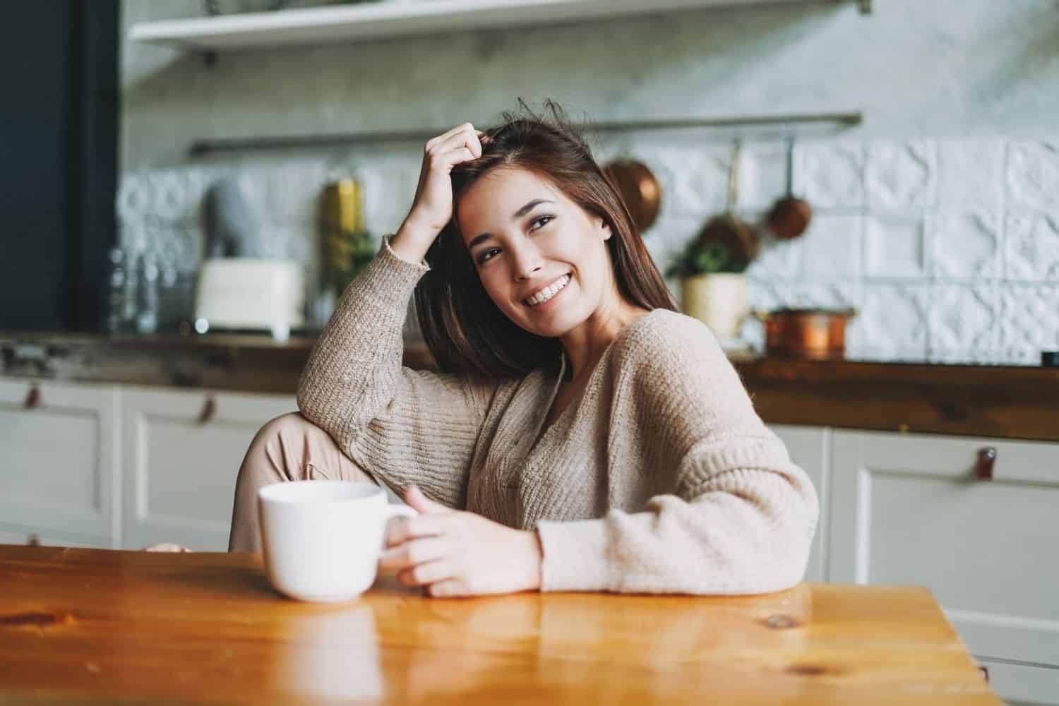 woman enjoying a cup of joe at home.