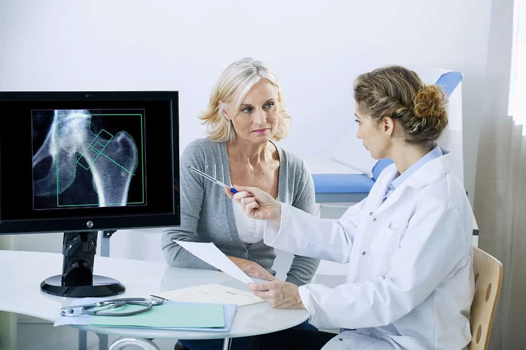 woman consultation with doctor regarding coffee and osteoporosis