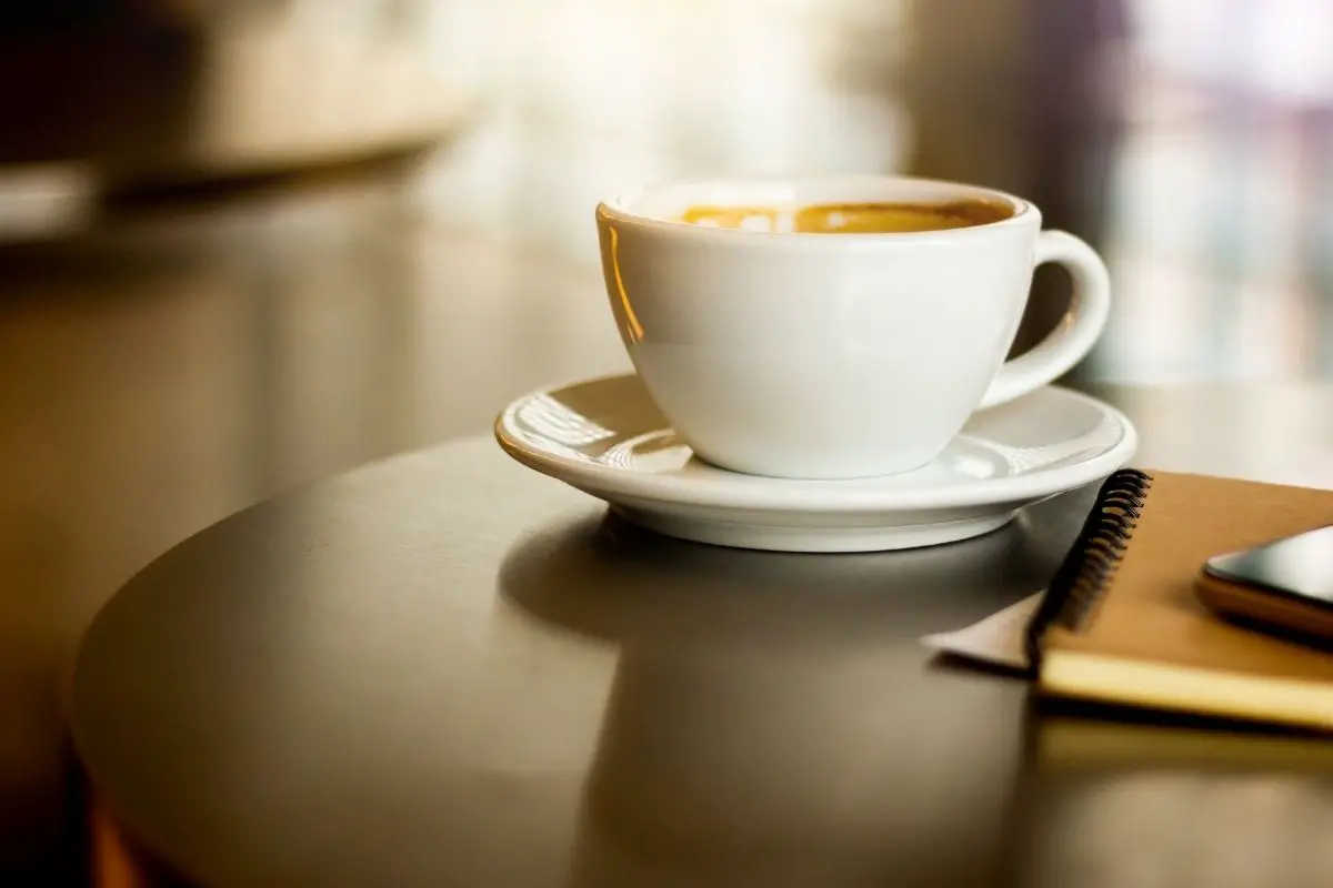 coffee in a white cup kept on a table