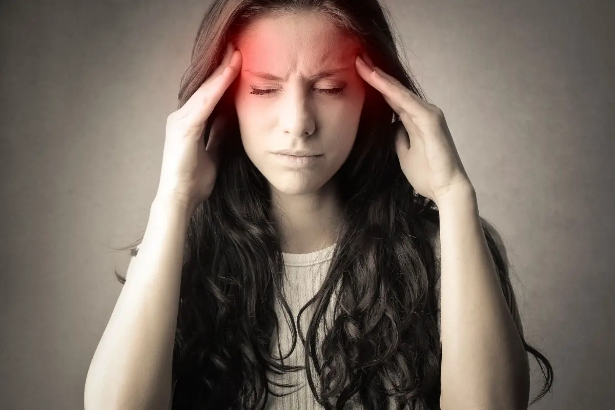 woman having a headache after giving up coffee