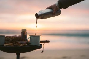 pouring coffee from the coffee thermos