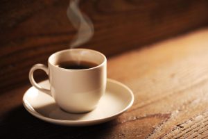 White cup on the wooden table