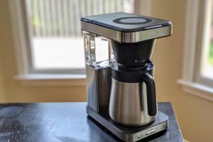 black coffee maker on black table