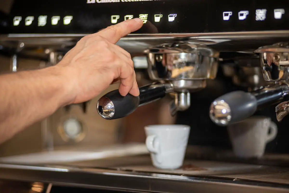 barista making an espresso